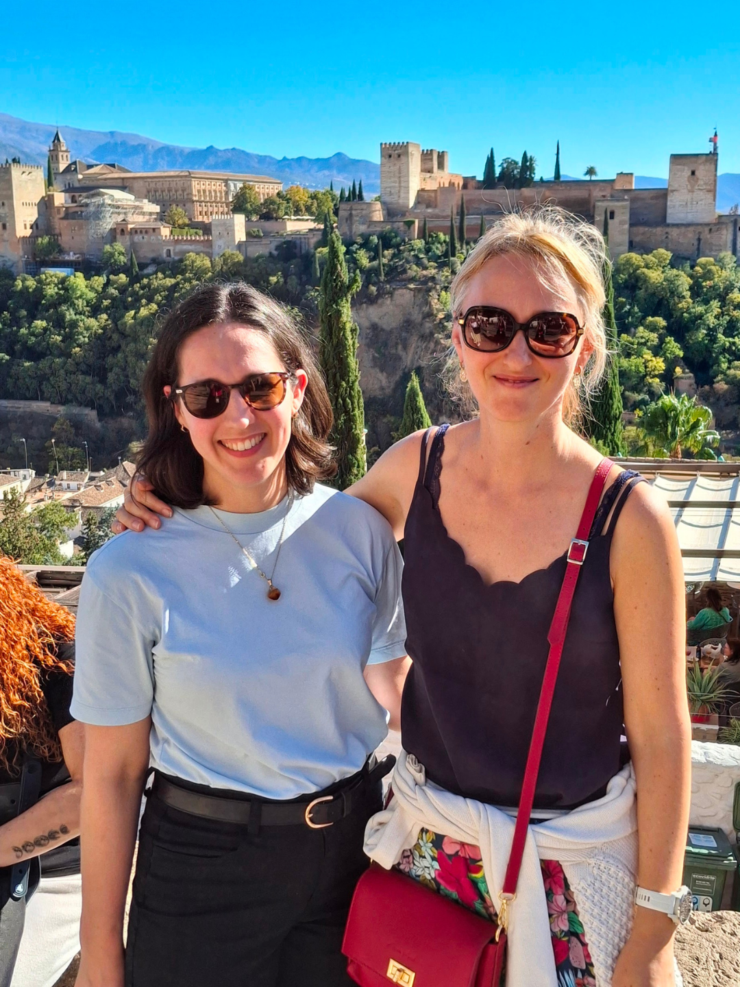 Emma Bolton and Julia Henze at Mirador de San Nicolás, Granada with the Alhambra in the background.