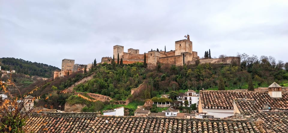 A view of the Alhambra, Granada surrounded by forest from the Albaicín.
